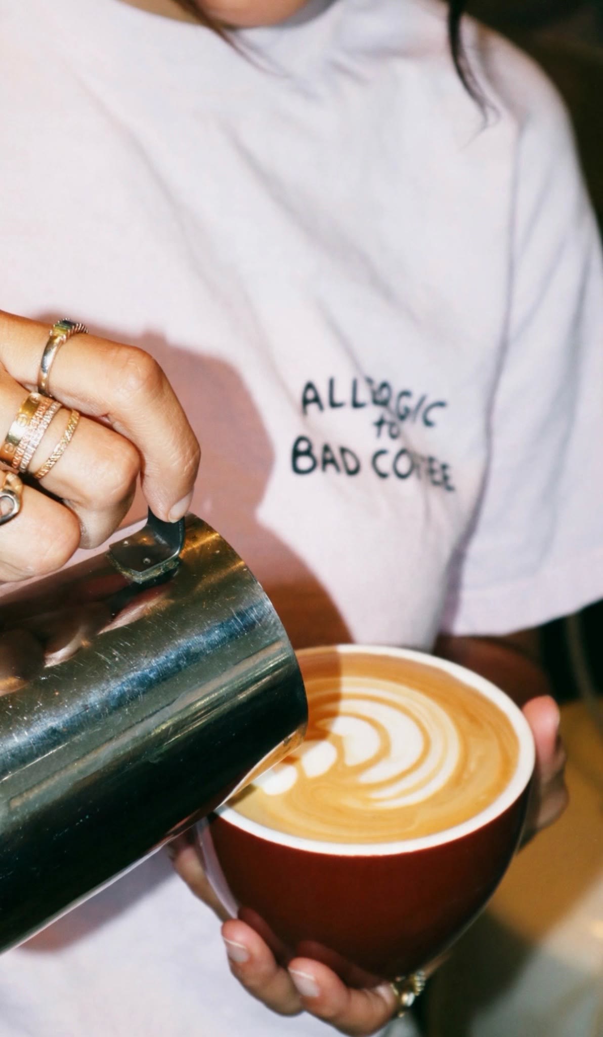 A Berni Bean barista pouring latte art